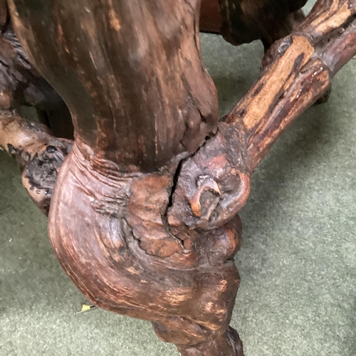 671 - Pair of rustic branch and root support circular wooden stools, possibly olive wood, 70cm H