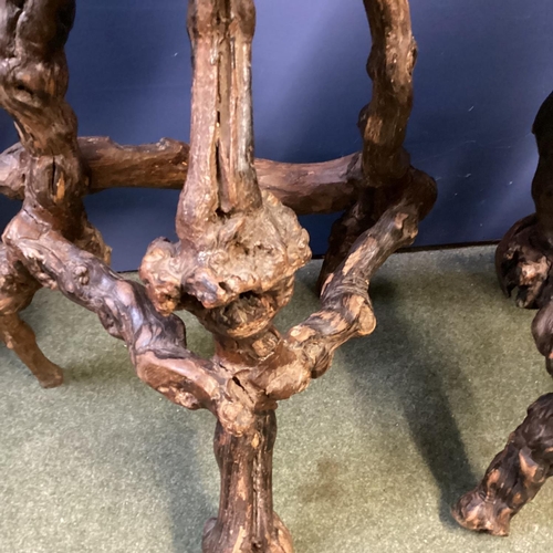 671 - Pair of rustic branch and root support circular wooden stools, possibly olive wood, 70cm H