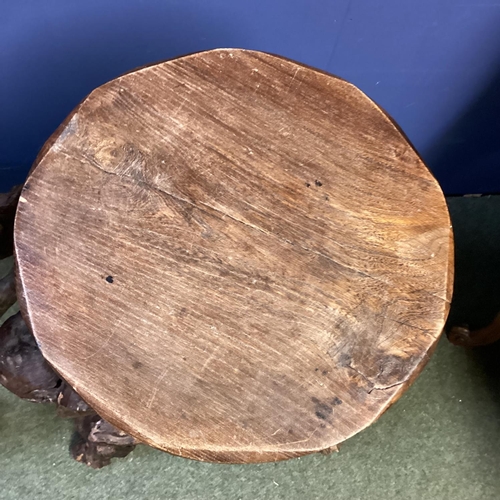 671 - Pair of rustic branch and root support circular wooden stools, possibly olive wood, 70cm H