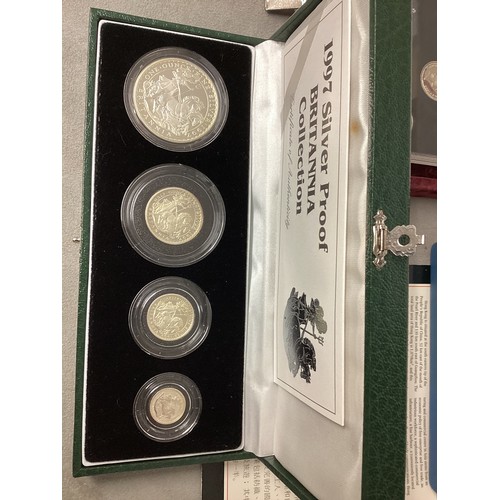 200 - A collection of silver and white metal commemorative  coins to include silver proof examples.