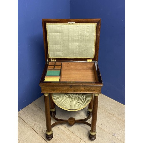 618 - A Regency rosewood work table with rising lid opening to reveal fitted interior, with a green pleate... 