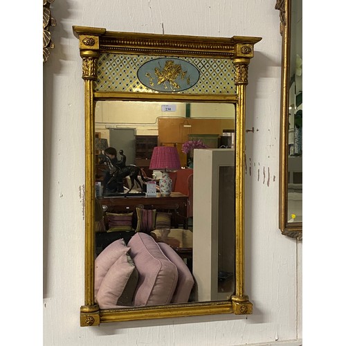 230 - A Georgian gilt pier mirror, rectangular plate with twin column support frame, topped by inset ename... 