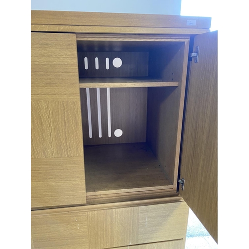 528 - A good oak cupboard unit