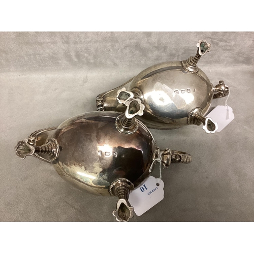 10 - A pair of Georgian Sterling silver sauce boats, beaded rim, scroll handles raised on three feet, by ... 