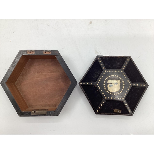 102 - A hexagonal porcupine box, with hinged lid and handle 21 x 18cm (damage to hinge)