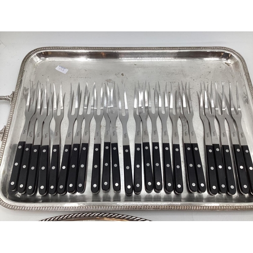 127 - 16 Carving knife and forks, Sebatier; together with two silver plated serving trays, each with loop ... 