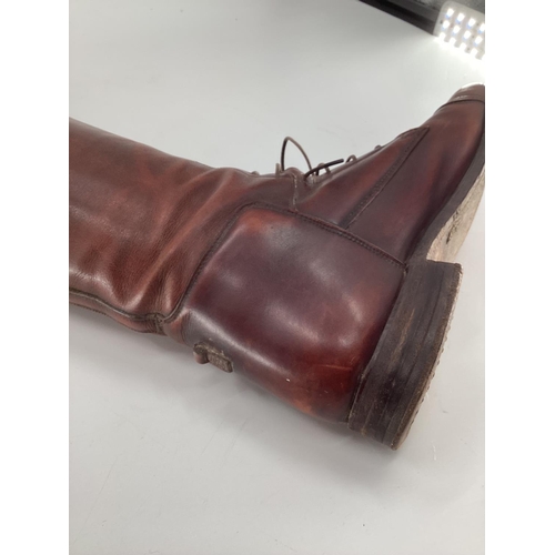 132 - Pair of  brown leather laced riding boots, with trees. Sole is 27.75cm
Length os psine of back all w... 