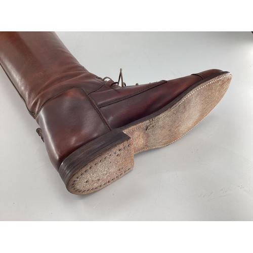 132 - Pair of  brown leather laced riding boots, with trees. Sole is 27.75cm
Length os psine of back all w... 