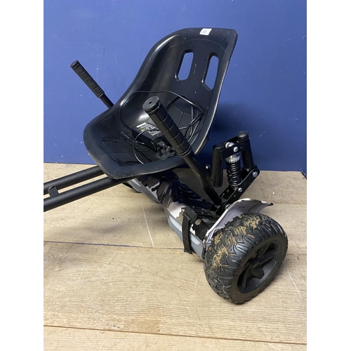 139 - A Segway, with Go cart attachment and charger, (separately purchased and attached); in working order... 