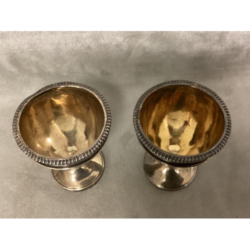 15 - A pair of Georgian silver egg cups with gilt interiors by Solomon Hougham, London 1811, 98g