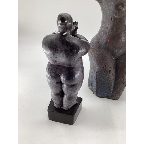 166 - A C20th Spelter model of a naked lady on a cast square plinth together with two cast metal torso bus... 