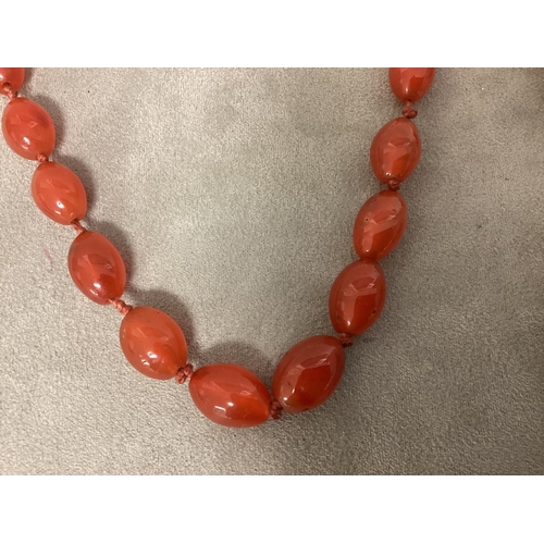 19 - A collection of costume jewellery together with a strand of graduated carnelian beads