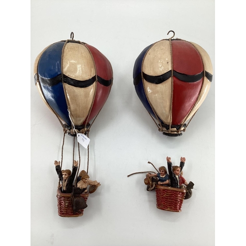 190 - A pair of decorative  papier Mache style hot air balloons, each 45cm H