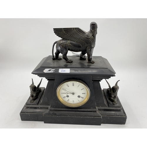 215 - A slate mantle clock,topped by mythical beast with sphinx 43cm W x 16cm D x 39cm H and two mantle cl... 