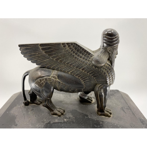 215 - A slate mantle clock,topped by mythical beast with sphinx 43cm W x 16cm D x 39cm H and two mantle cl... 