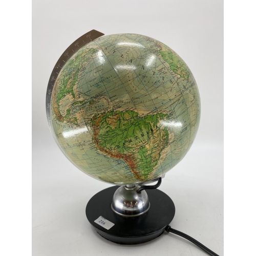 216 - A mid century JRO globus, Munich, illuminated globe on turned ebonised stand, 38cmH