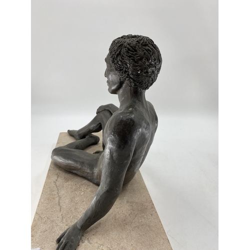 220 - A bronzed effect reclining nude gentleman on a rectangular marble base, 50 x 24 x 38cm H