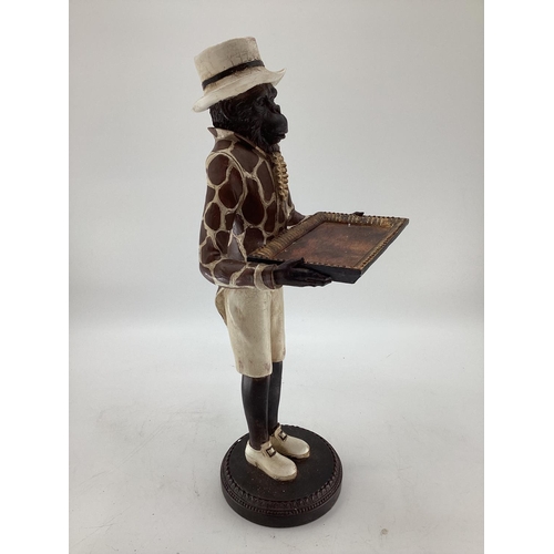 222 - A composite model of a Chimpanzee in hat and coat  and card trau 60cmH