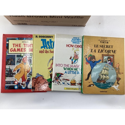 235 - A large collection of Paperback Tin Tin and Asterix books