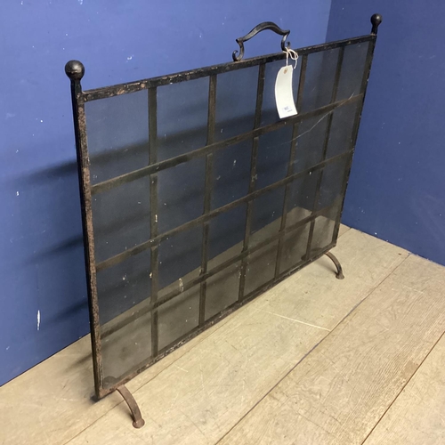 250 - A black metal fire screen, with square lattice pattern, 86cmH x 102cmW