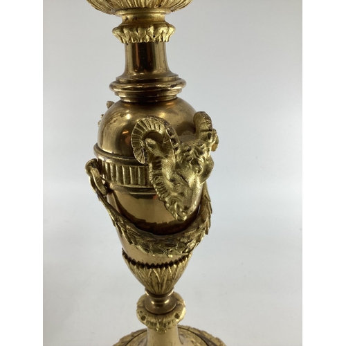 258 - Pair of C19th gilt brass five branch table candelabras, on circular stepped bases, with goats head d... 