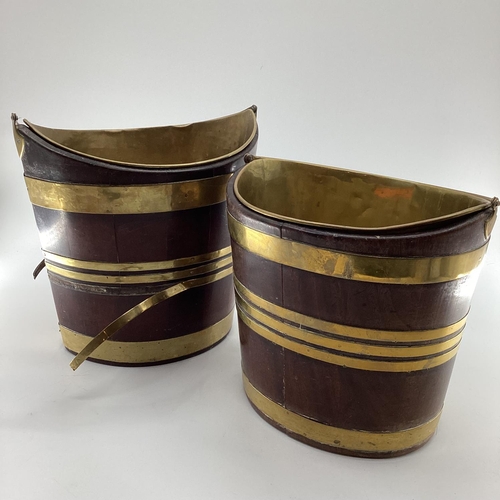 259 - Two late C19th oval mahogany brass bound peat buckets, with brass lined interiors and loop handles, ... 