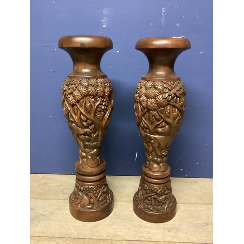 264 - Pair of profusely carved oriental style hardwood floor vases, 79cmh, as found