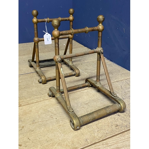 269 - A pair of brass, Arts & Crafts style geometric shaped fire dogs, 26cmH