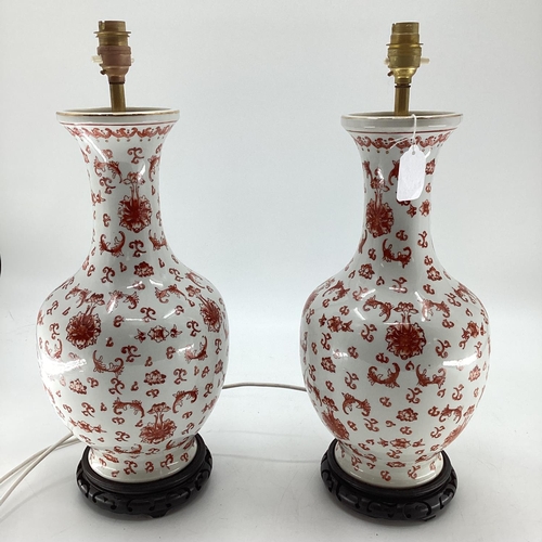 272 - A pair of Chinese style decorative table lamps, white ground with all over orange foliage pattern, 4... 