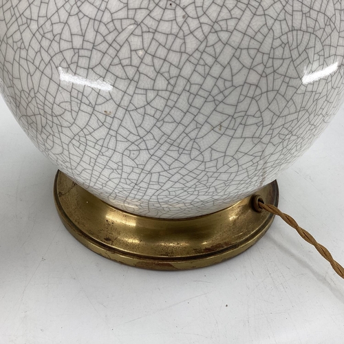 273 - A pair of bulbous white and all over crackle glaze table lamps, with brass style base and fittings f... 