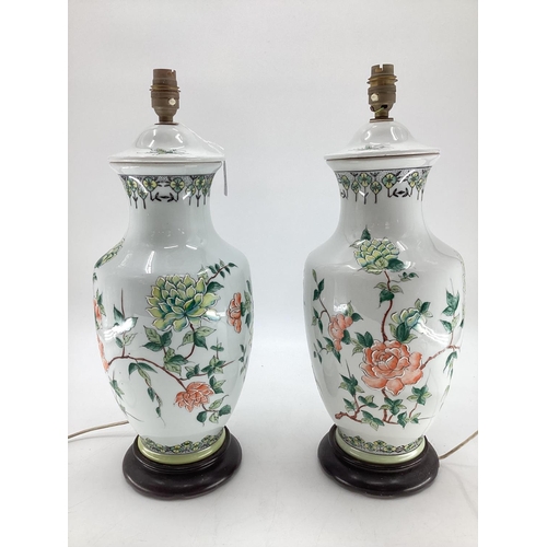 274 - A pair of Chinese style table lamps, white ground and green and pink foliage, on stands, 49cm H over... 