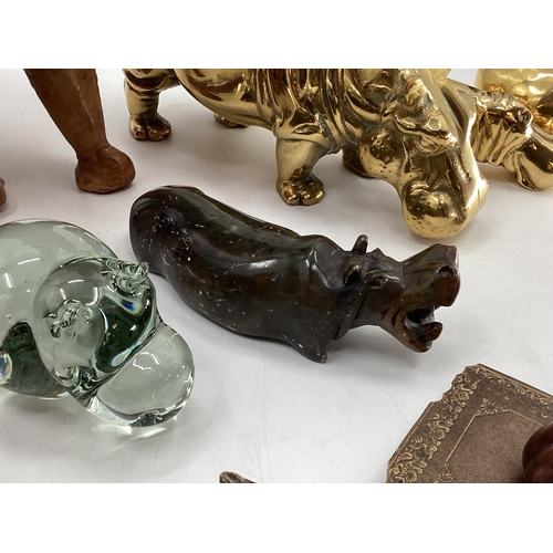 281 - A collection of model Hippos, glass, metal, wood, and a Limoges lidded box with hippo, all as found,... 