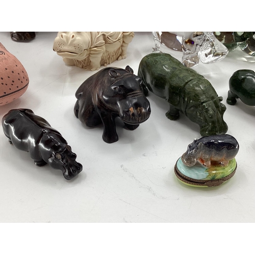 281 - A collection of model Hippos, glass, metal, wood, and a Limoges lidded box with hippo, all as found,... 