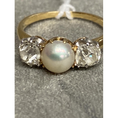 3 - An unmarked yellow and white metal pearl and diamond ring, central button pearl with old cut diamond... 