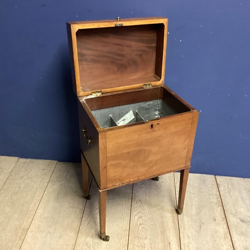 313 - A good m mahogany wine cooler, with four tapered legs to castors, inside fitted metal wine compartme... 