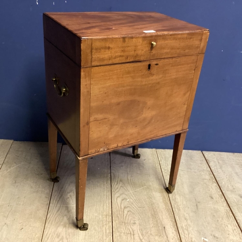 313 - A good m mahogany wine cooler, with four tapered legs to castors, inside fitted metal wine compartme... 