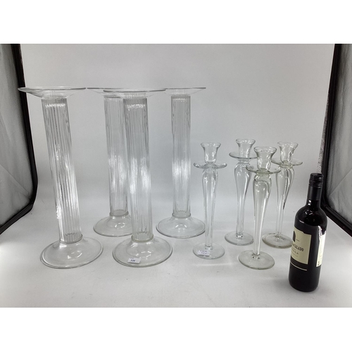 320 - A quantity of decorative glass candlesticks