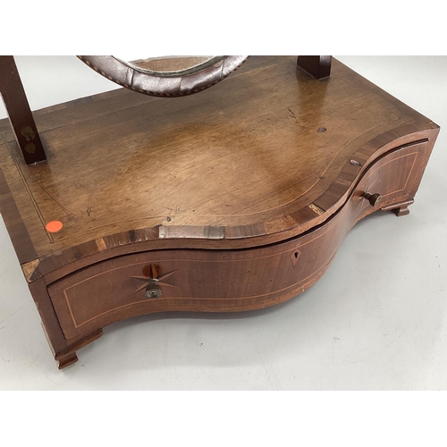 333 - Oval mahogany dressing table mirror, with serpentine front and drawer to front