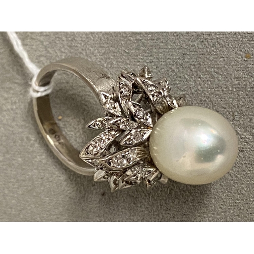 4 - An 18c white gold, pearl and diamond ring, central single pearl, approx 12mm set with double surroun... 