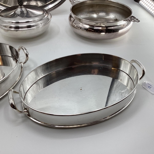 42 - A collection of silver plated and white metal table ware