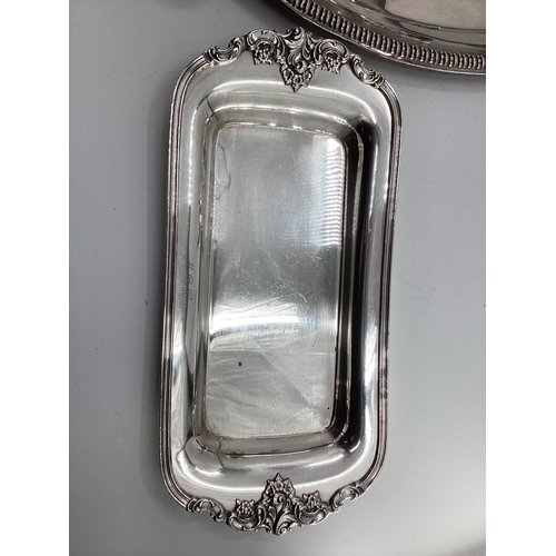 44 - A large collection of silver plated and white metal items to include a large oval tray with loop han... 