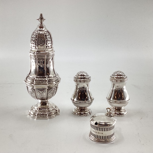 46 - A pair of sterling silver pepperettes, a small mustard and a German white metal sugar shaker