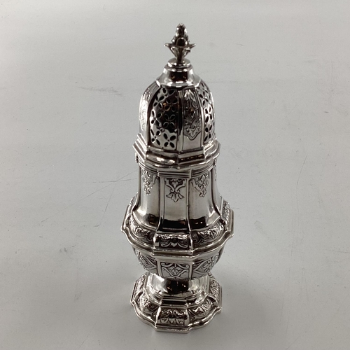 46 - A pair of sterling silver pepperettes, a small mustard and a German white metal sugar shaker