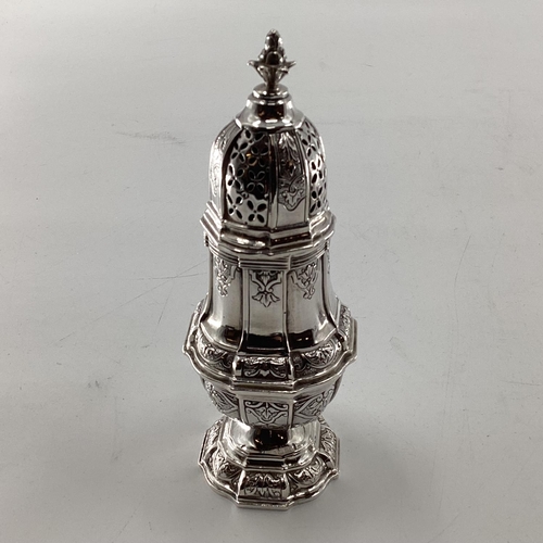 46 - A pair of sterling silver pepperettes, a small mustard and a German white metal sugar shaker