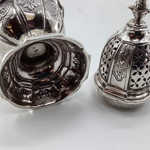 46 - A pair of sterling silver pepperettes, a small mustard and a German white metal sugar shaker