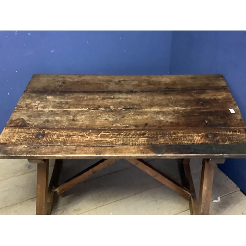 465 - A plank top rustic oak table with X base, 116cmW x 78cm x 70cm, as found, on the lean