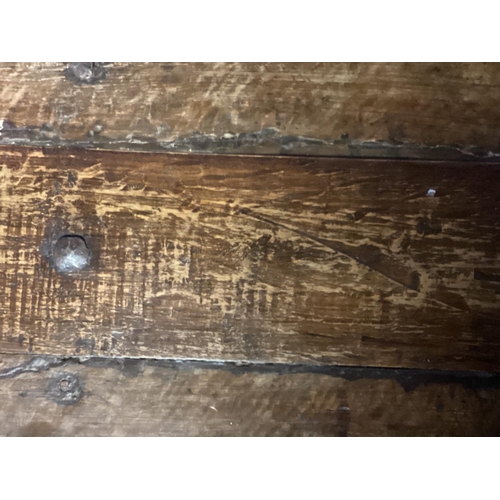 465 - A plank top rustic oak table with X base, 116cmW x 78cm x 70cm, as found, on the lean