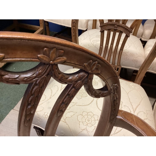 467 - A good set of 12 (10+2 carvers) Chippendale style dining chairs with cream upholstery, 95cmH