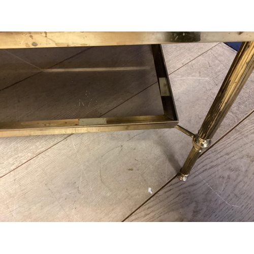 477 - A Brass and glass  two tier coffee table 90.5cm W x 46cm D x 41cm H (  a little bit wobbly, but no b... 