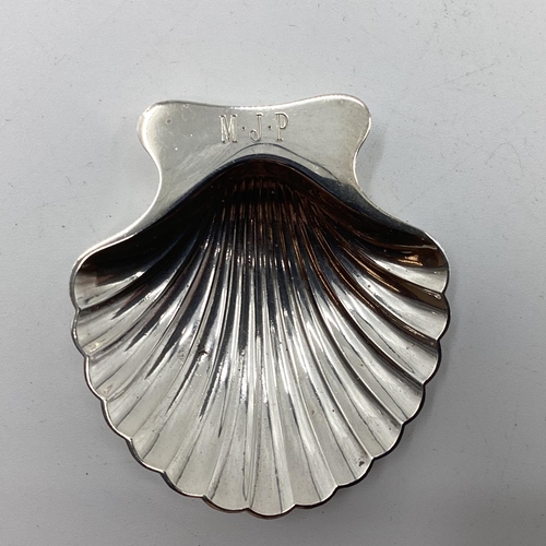 48 - A collection of Sterling silver and white metal items to include a scallop shaped dish by Tiffany & ... 